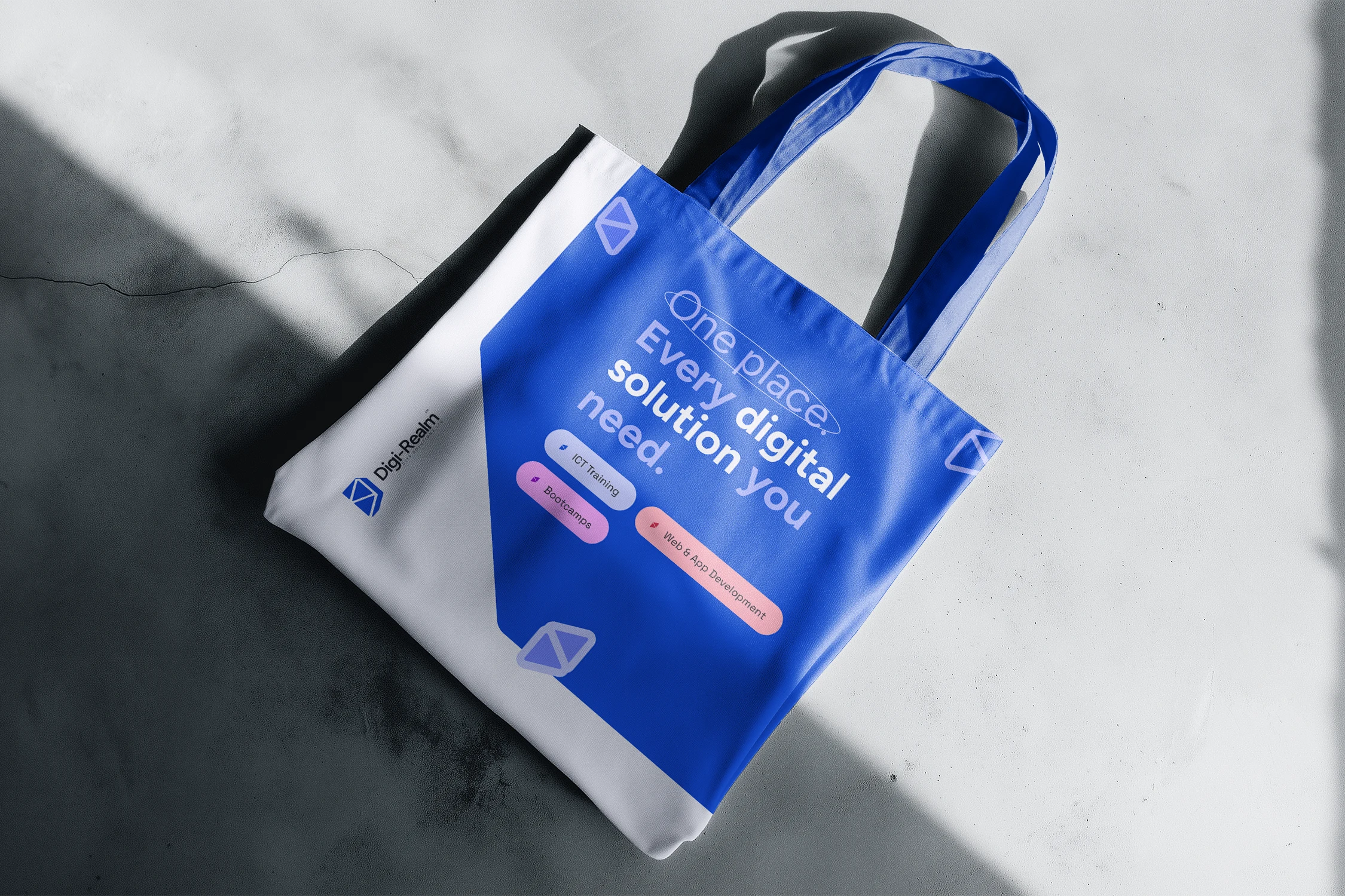 Digi-Realm campaign artwork on a tote bag mockup